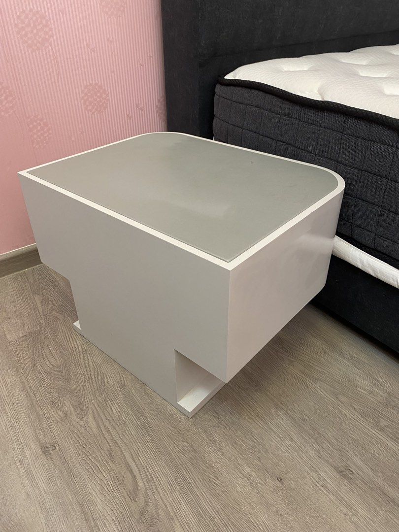 Interior designed bedside table (Category: Tables & Sets) located in Singapore. Submitted by Instantmee87 (Listing ID 1458602349, Image 3). Description: Bed side table Dimension: W50cm x D38cm x H35cm White color bed side table with Light Gray color leather top. Specially made for condo showflat standard. Selling $20 for self collection at Sengkang Grand Residences or Buangkok MRT.