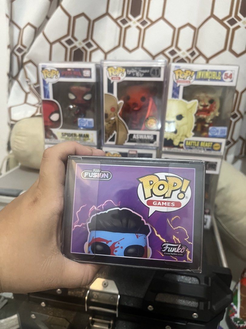 Invincible chase #1098 8.5/10 (Category: Raw Singles) located in Bulacan. Submitted by devegazul124 (Listing ID 1458684102, Image 2). Description: What you see is what you get, all pops are authentic, no low balling, trades are accepted depending on buyer’s offer, great for starting collectors and invincible fans, lastly pops behind are not included..