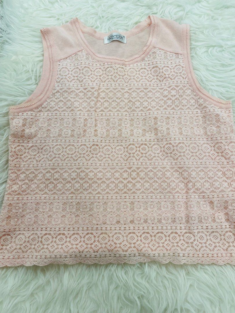 JApan Pink Lace Tank Top (Category: Sleeveless) located in Quezon City. Submitted by TGDL123 (Listing ID 1458592564, Image 1). Description: - Brand: KAZAMIDORI - Color: Pink - Style: Sleeveless top - Design: All-over lace pattern - Features: Ribbed neckline and armholes - Material: Soft and comfortable - Versatile: Great for layering or wearing alone.