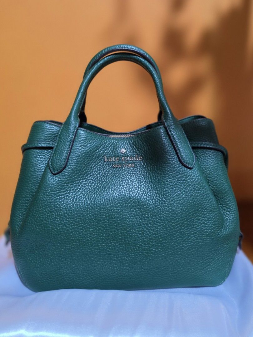 Kate Spade Green Leather Top Handle Bag with Strap (Category: Luxury Bags & Wallets) located in Pasig City. Submitted by miamendoza30 (Listing ID 1458532740, Image 1). Description: - Authentic Green Kate Spade Handbag - Pebbled Leather Texture - Top Handles & Detachable Crossbody Strap - Secure Zipper Closure - Multiple Interior Compartments - Elegant Gold Hardware Details - Comes with Original Dust Bag - Ideal for Everyday Use.