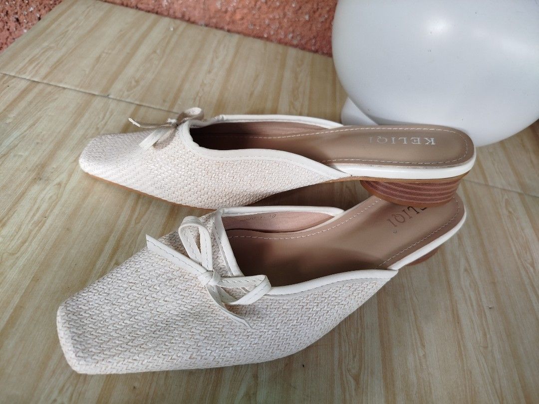 KELIQI White Woven Square Toe Bow Mules (Category: Flats & Sandals) located in Cabuyao City. Submitted by elaine.toqz (Listing ID 1458544432, Image 3). Description: - White woven mules - Adorable bow detail on the toe - Trendy square toe design - Comfortable low block heel - Easy slip-on style - Versatile for casual or dressed-up outfits.