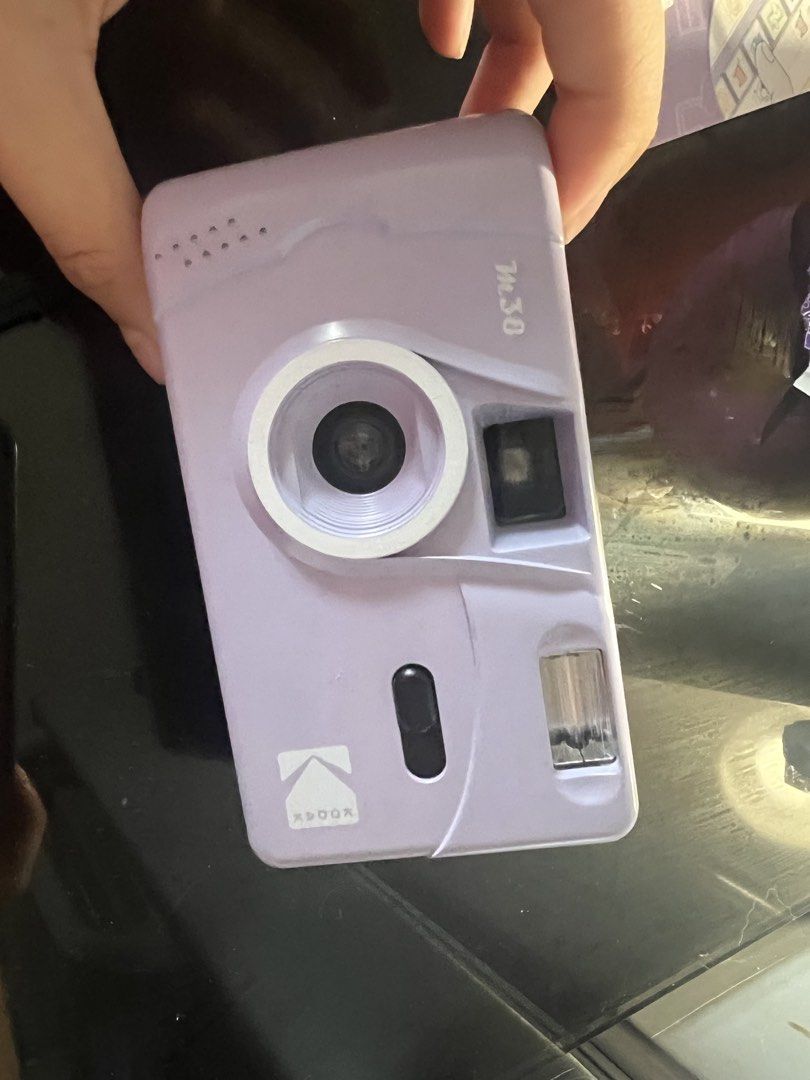 Kodak M38 Film Camera - Lavender (Category: Cameras) located in Manila. Submitted by rosiesaysay (Listing ID 1458568951, Image 2). Description: - Lavender Kodak M38 film camera - Built-in flash - Uses 35mm film - Rewind knob on the side - Ideal for beginners and film photography enthusiasts - Simple point-and-shoot operation.