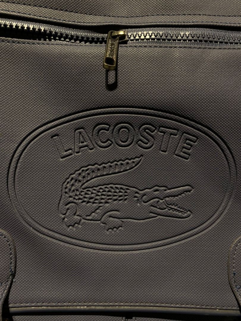 Lacoste Expandable Messenger Bag (Category: Laptop Bags & Sleeves) located in Antipolo. Submitted by mogulcollective (Listing ID 1458680780, Image 3). Description: Lacoste Expandable Messenger Bag Authentic Excellent condition Features two main compartments with a zipped divider, has an accessible zip-fastened front pocket integrated into the flap, secured by twin buckle straps, two sub-pockets underneath the flap and large one at the rear, adjus