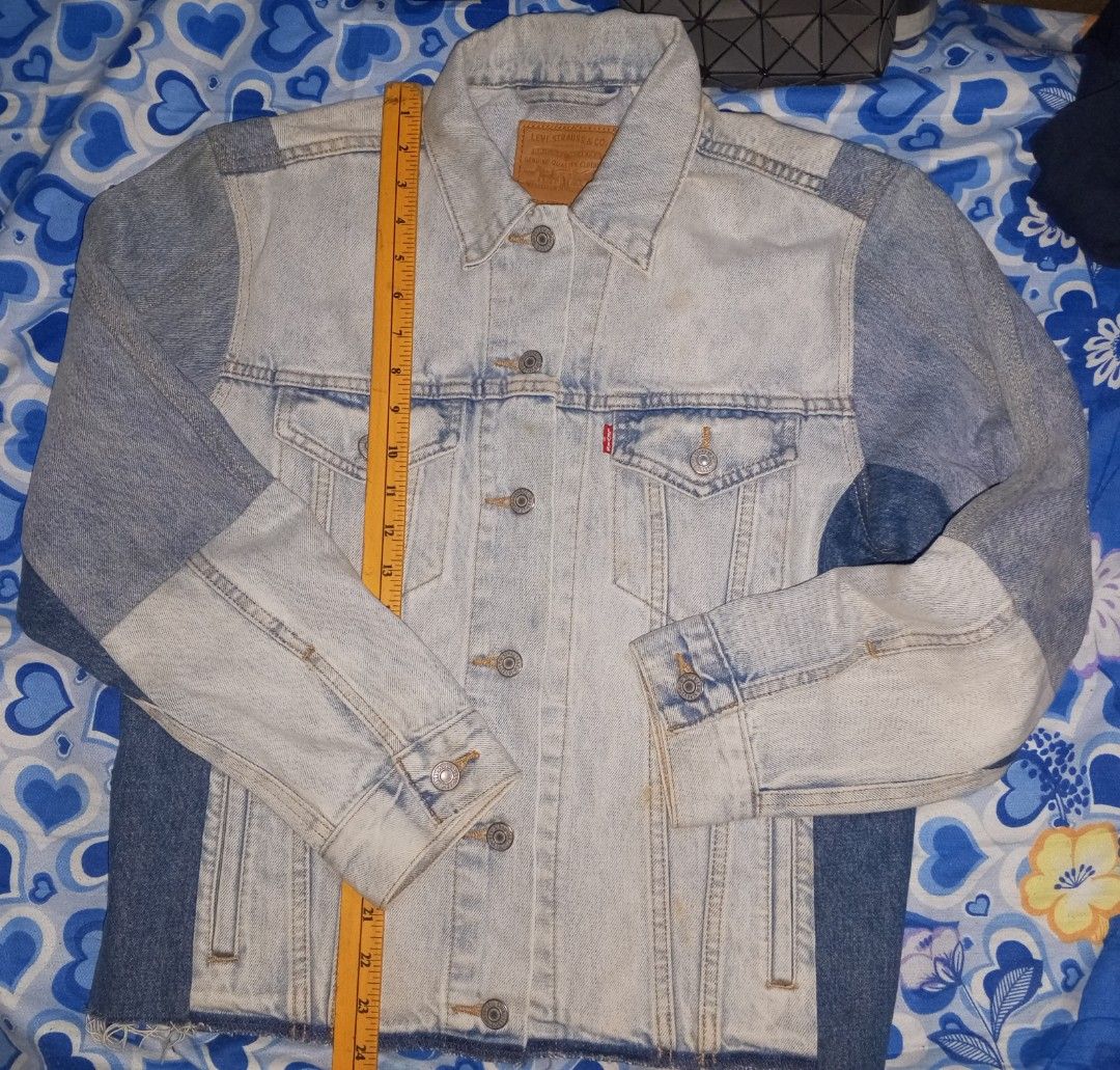 Levi's Strauss & Co. Patchwork Denim Jacket Size M (Category: Coats, Jackets and Outerwear) located in Magalang. Submitted by zeiansoria64090 (Listing ID 1458501401, Image 1). Description: - Classic Levi's denim jacket - Unique patchwork design with varied denim washes - Button-up front closure - Two chest pockets - Size: Medium - Ideal for layering - Versatile wardrobe staple.