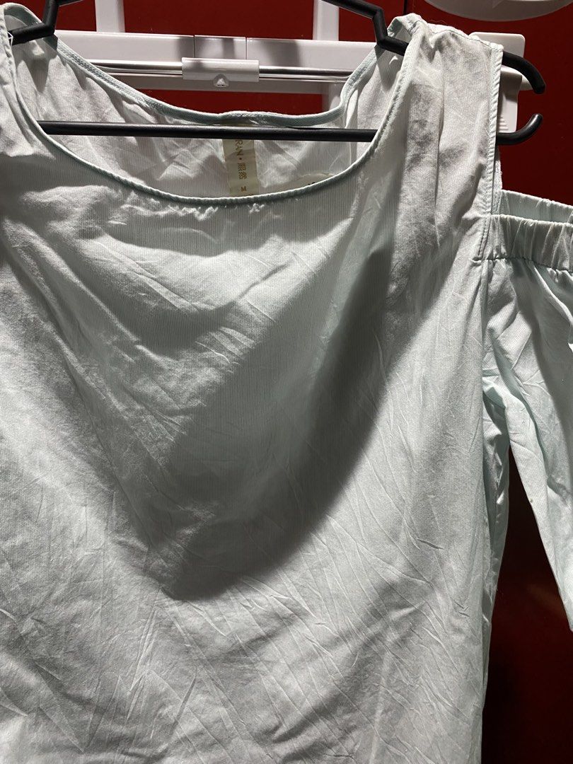 Light Blue Cold Shoulder Top with Tie Sleeves (Category: Blouses) located in Bauang. Submitted by nrrandomthings (Listing ID 1458660377, Image 2). Description: - Light blue top with a chic pinstripe pattern. - Trendy cold shoulder design with adjustable tie details on the sleeves. - Made from a lightweight, crinkled fabric for comfort. - Effortlessly style for a casual and relaxed look. - Ideal for staying cool and fashionable in warmer weather..