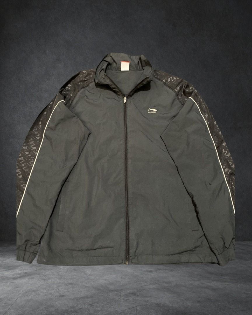 Li-Ning Black Track Jacket (Category: Coats, Jackets and Outerwear) located in Las Pinas. Submitted by w_thriftz (Listing ID 1458688143, Image 1). Description: W 23 L 28 Issue Hole in Left sleeve, tiny holes front area.