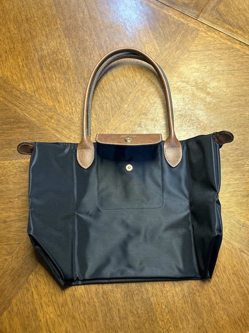 Longchamp Le Pliage Black (Category: Tote Bags) located in Quezon City. Submitted by luxurybyluci (Listing ID 1458501357, Image 2). Description: Longchamp Le Pliage Black Medium 7,000 with sling with inclusion authentic .