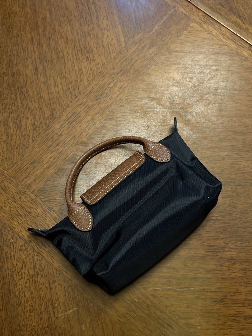 Longchamp Le Pliage Mini (Category: Luxury Bags & Wallets) located in Quezon City. Submitted by luxurybyluci (Listing ID 1458500052, Image 2). Description: Longchamp Le Pliage Black Mini 7,000 with sling with inclusion authentic .