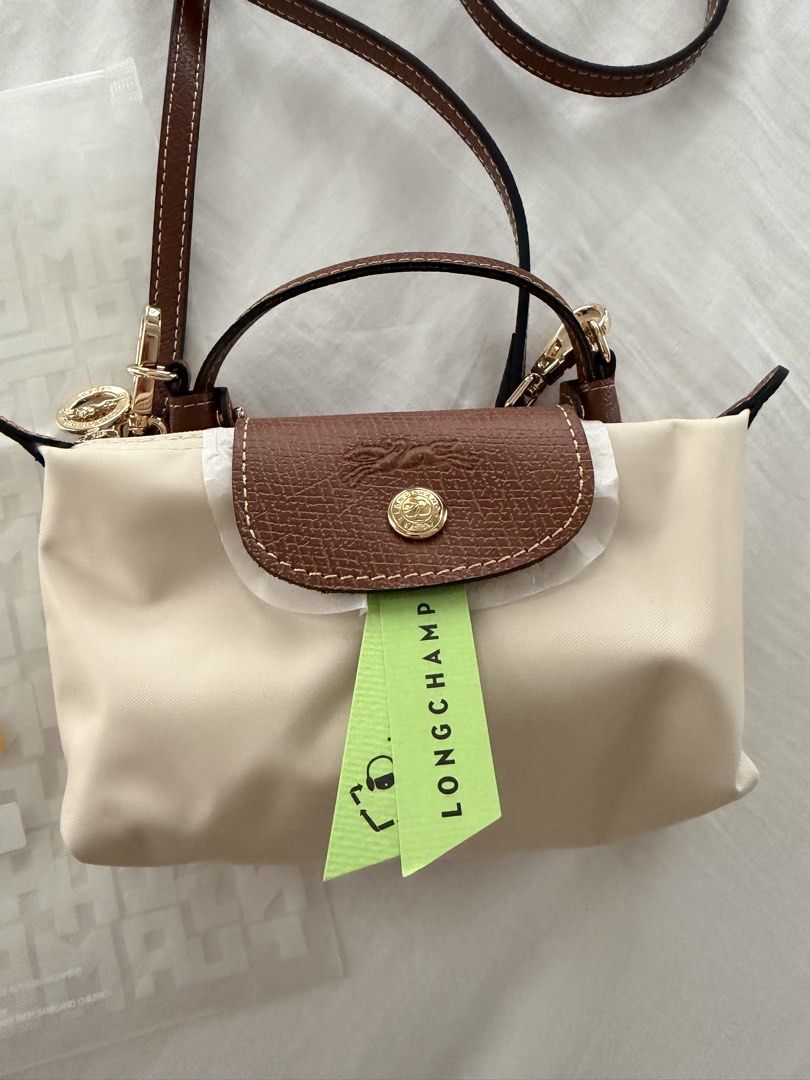 Longchamp Le Pliage Mini (Category: Cross-body Bags) located in Cabanatuan. Submitted by frugalchic.md (Listing ID 1458547639, Image 2). Description: With free long adjustable strap Used once only.