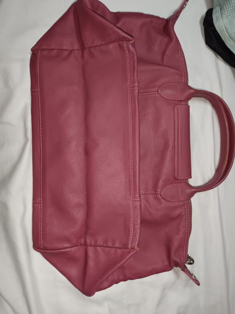 Longchamp Rose Pink Leather Tote Bag (Category: Luxury Bags & Wallets) located in Bulacan. Submitted by Ely1112222 (Listing ID 1458594698, Image 3). Description: -Original -No Price tag -No Dustbag - No strap - Authentic Longchamp tote bag - Soft rose pink leather - Spacious interior - Comfortable top handles - Secure zipper closure - Classic design for everyday use.