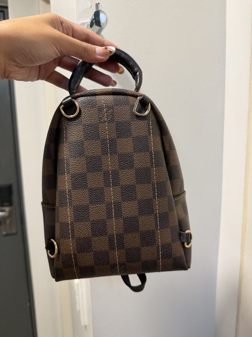 Louis Vuitton Damier Ebene Canvas Mini Backpack (Category: Luxury Bags & Wallets) located in Manila. Submitted by previosly.mine (Listing ID 1458573718, Image 3). Description: - Louis Vuitton Mini Backpack - Damier Ebene canvas with classic checkered pattern - Gold-tone hardware - Top handle and adjustable shoulder straps - Front zipper pocket - Compact and stylish, ideal for carrying essentials Bday month Sale!!.