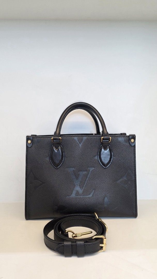Louis Vuitton Empreinte OTG PM (Category: Luxury Bags & Wallets) located in San Fernando. Submitted by bagproject (Listing ID 1458620147, Image 1). Description: - Authentic Louis Vuitton Speedy Bag - Color: Black - Material: Monogram Empreinte Leather - Hardware: Gold-tone - Features: Top handles, detachable shoulder strap - Interior: Spacious, ideal for everyday essentials and more - Versatile: Suitable for daily use or special occasions - w/ En