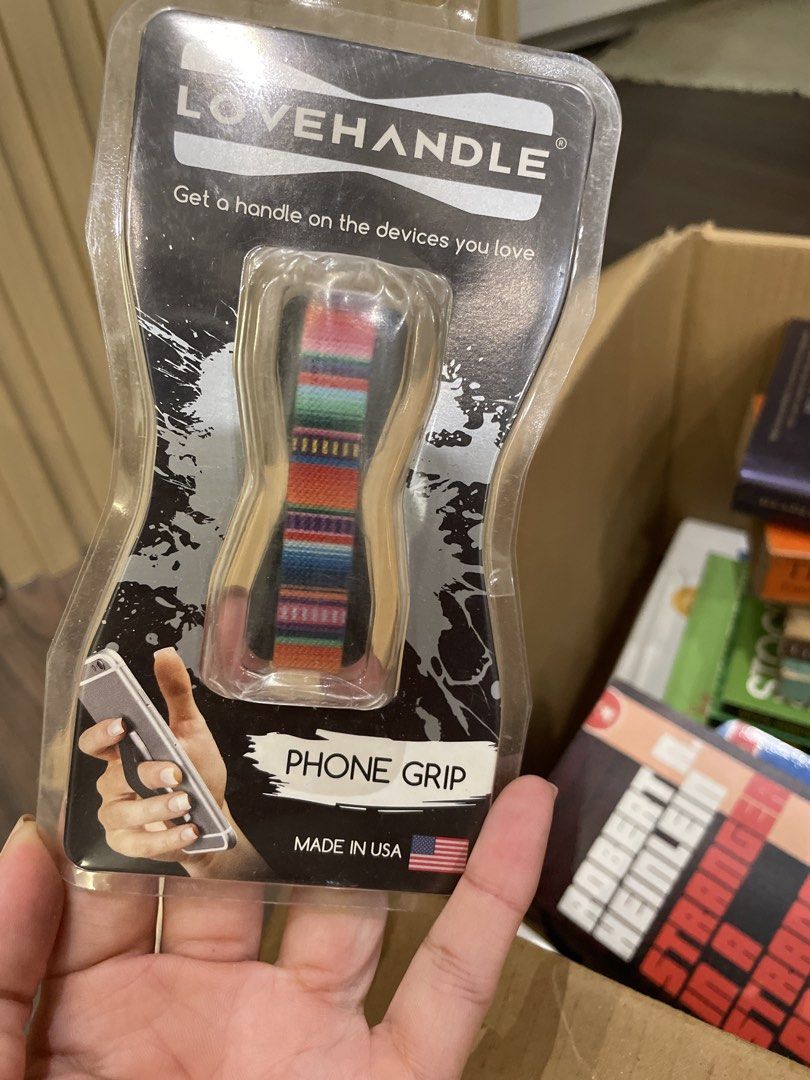 LOVEHANDLE Universal Phone Grip - Serape/Black Base (Category: Other Mobile & Gadget Accessories) located in Makati City. Submitted by randombloggingstuff (Listing ID 1458594247, Image 1). Description: - Secure your phone with the LOVEHANDLE universal grip. - Features a vibrant, colorful serape pattern. - Attaches easily and securely with strong VHB tape. - Simple application: clean, peel, and stick. - Proudly made in the USA. - Makes holding you