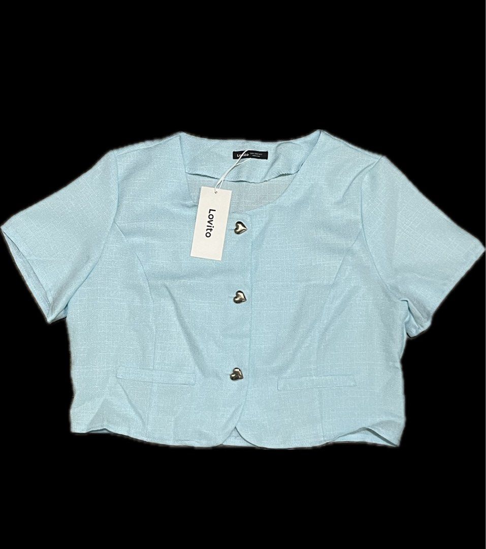 Lovito Light Blue Cropped Short Sleeve Blazer (Category: Blouses) located in Mandaluyong City. Submitted by namislounge (Listing ID 1458639213, Image 1). Description: Brand new with original pouch! - Brand: Lovito - Color: Light Blue - Style: Cropped Top - Neckline: Round Neck - Sleeves: Short Sleeves - Features: Cute heart-shaped buttons down the front, two small chest pockets - Occasion: Great for casual wear.