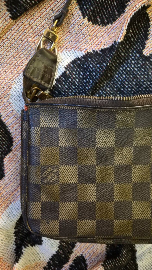 LV Damier Pochette (Category: Luxury Bags & Wallets) located in Manila. Submitted by declutterwithme__ (Listing ID 1458624820, Image 2). Description: Authentic LV Damier Pochette Code: CA 3710 Needs bag spa no inclusions bag only rfs: decluttering .