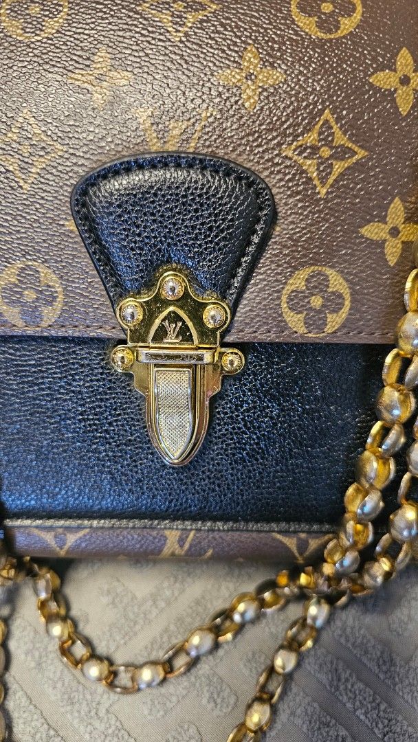 LV Victoire Monogram Chain Shoulder Bag (Category: Luxury Bags & Wallets) located in Quezon City. Submitted by jollythrift (Listing ID 1458513115, Image 2). Description: This is a coded Victoire bag from Louis Vuitton showcases the brand's affinity for their historic trunks. Featuring signature Louis Vuitton Monogram coated canvas with chic black calfskin leather, the slide-lock on the front is a reinterpretation of the fashion house's classic de
