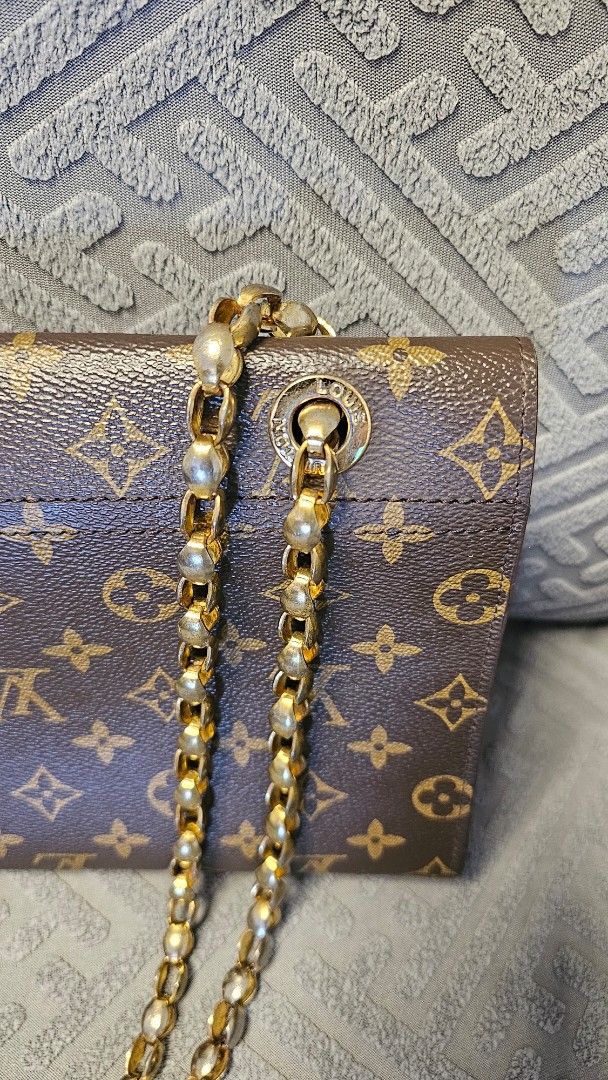 LV Victoire Monogram Chain Shoulder Bag (Category: Luxury Bags & Wallets) located in Quezon City. Submitted by jollythrift (Listing ID 1458513115, Image 3). Description: This is a coded Victoire bag from Louis Vuitton showcases the brand's affinity for their historic trunks. Featuring signature Louis Vuitton Monogram coated canvas with chic black calfskin leather, the slide-lock on the front is a reinterpretation of the fashion house's classic de