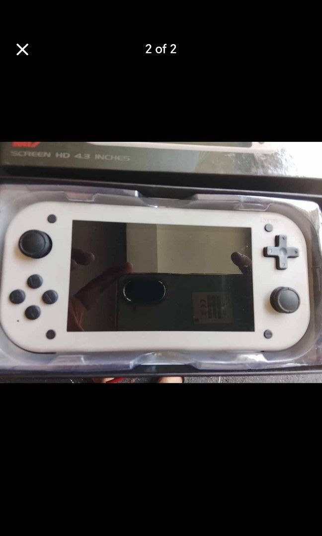 M17 SJGAM Handheld Video Game Console 4.3 Inch Screen (Category: Others) located in Manila. Submitted by tamiyabron04903 (Listing ID 1458575986, Image 1). Description: - White SJGAM handheld video game console - 4.3 inch HD screen - Equipped with D-pad and analog sticks - Perfect for gaming on the go - Includes original packaging.