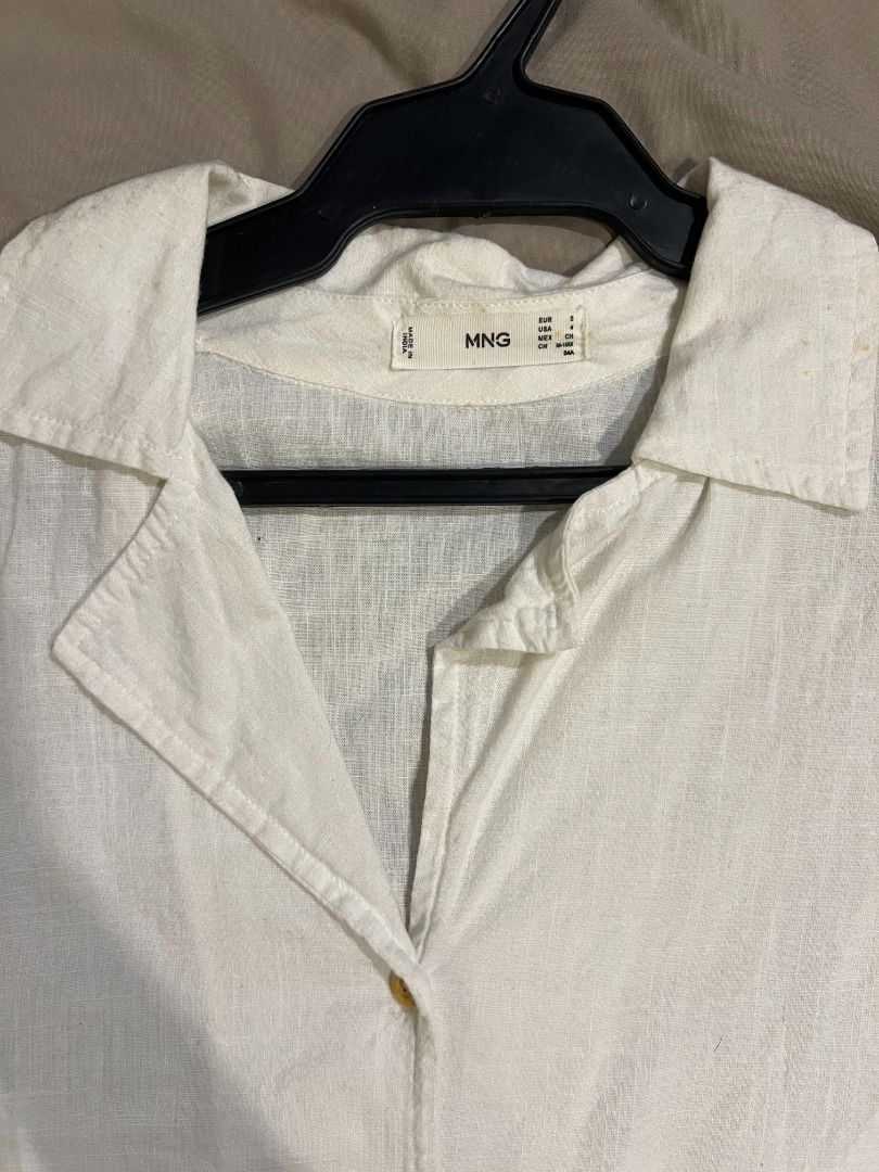 MANGO White Linen Blend Tie Front Shirt (Category: Shirts) located in Paranaque City. Submitted by cute.things.only (Listing ID 1458632079, Image 2). Description: White linen-blend shirt with tie front, collar, and buttons. Versatile for casual or dressy outfits. There are some stains by the collar (please see second photo)..