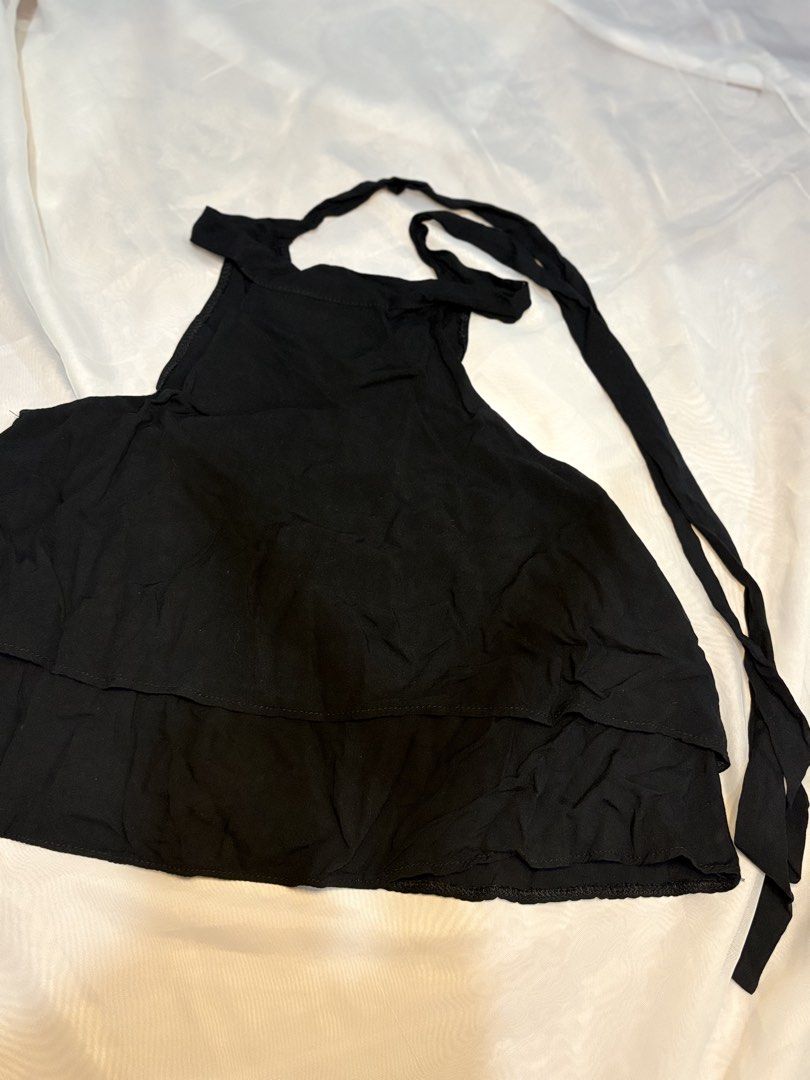 Marian key hole back halter neck double layer top (Category: Sleeveless) located in Binan City. Submitted by iluvm0nchichi (Listing ID 1458680002, Image 2). Description: - Black halter neck top - Tiered ruffle peplum hem - Adjustable back ties - Lightweight fabric - Perfect for dressing up or down - Style with shorts or a skirt.