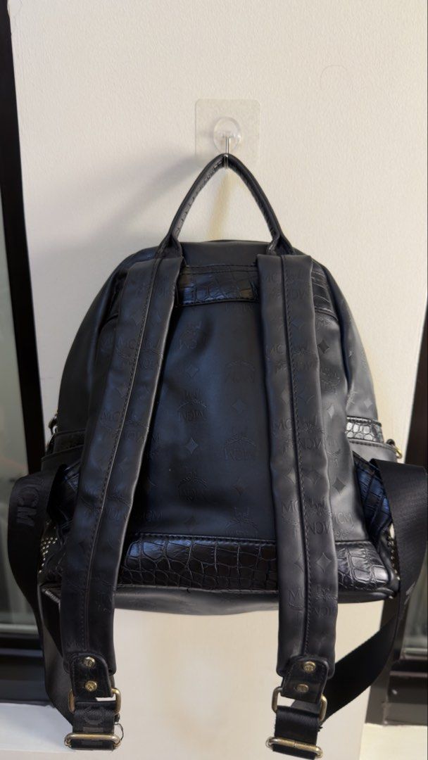 MCM 2000s studded backpack (Category: Backpacks) located in Paranaque City. Submitted by preluxeshop_ph (Listing ID 1458684032, Image 3). Description: MCM 2000s studded backpack black top handle adjustable shoulder straps silver-tone studs front zip pocket main compartment zip closure Condition: GOOD. This previously owned and used item is in good condition with minimal signs of use. This may include fading of material or plating and scratches. P