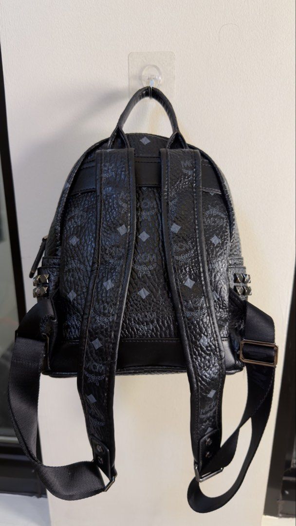 MCM Stark Backpack (Category: Backpacks) located in Paranaque City. Submitted by preluxeshop_ph (Listing ID 1458683971, Image 3). Description: MCM Stark Backpack black monogram print stud embellishment logo plaque adjustable shoulder straps single top handle front zip-fastening pocket two side slit pockets two-way zip fastening Made in Italy Product measurements Depth: 13 cm (5.11 in) Height: 33 cm (12.99 in) Width: 26 cm (10.23 in).