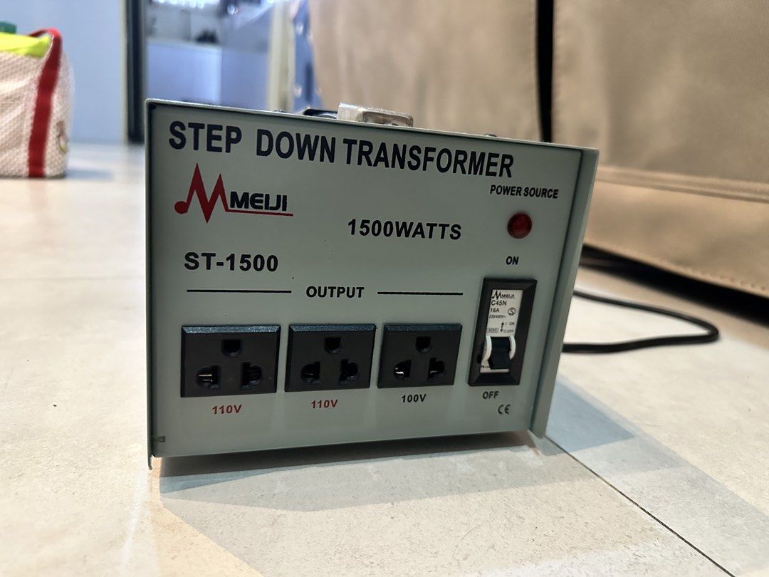 Meiji ST-1500 Step Down Transformer 1500 Watts (Category: Electrical, Adaptors & Sockets) located in Quezon City. Submitted by happysissies (Listing ID 1458558863, Image 1). Description: - Meiji ST-1500 Step Down Transformer - 1500 Watts Capacity - Input: 220V - Output: 2 x 110V sockets, 1 x 100V socket - Power Source Indicator Light - ON/OFF Switch - Fuse Protection Included - Ideal for converting voltage for your appliances Originally bought at