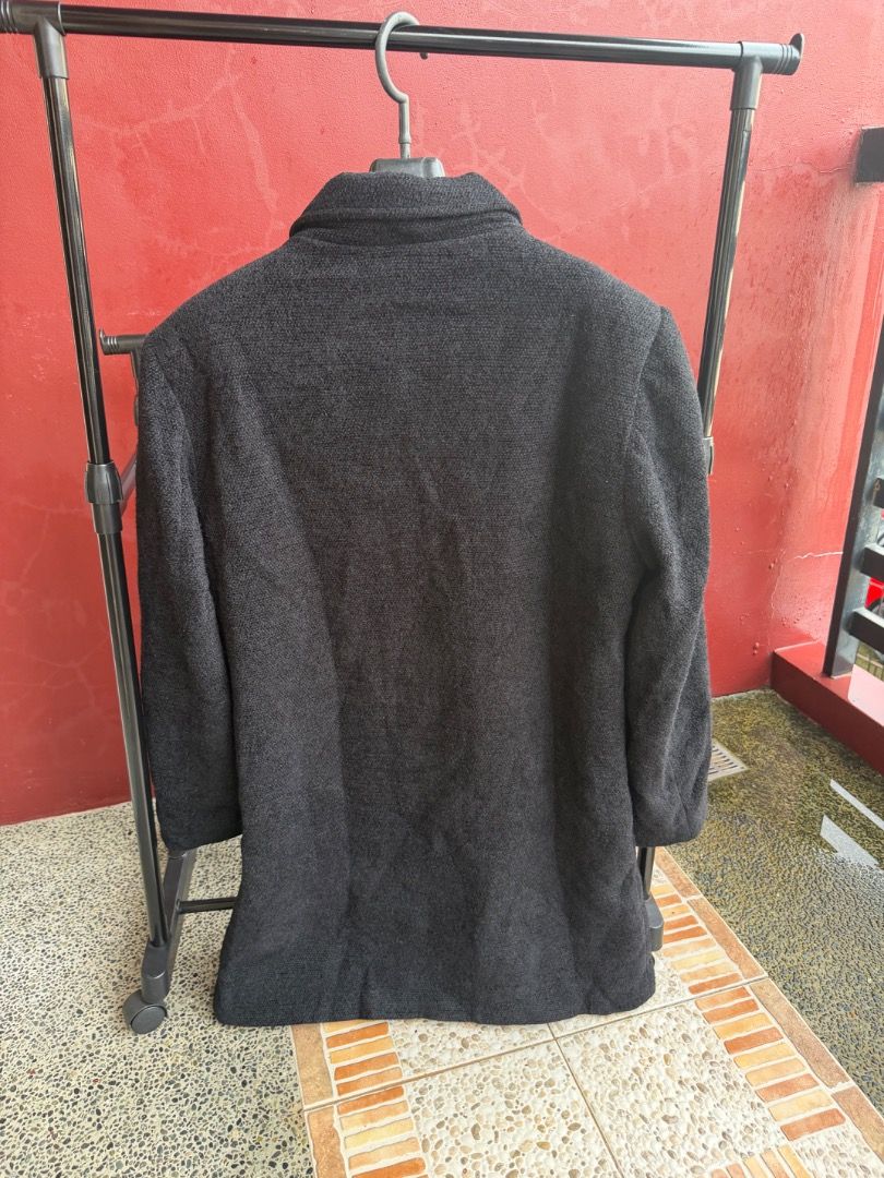 Men's Dark Grey Wool Blend Long Winter Coat (Category: Coats, Jackets and Outerwear) located in Manila. Submitted by transbox (Listing ID 1458545468, Image 2). Description: - Dark grey textured long coat - Button-up front with collared neckline - Fully lined interior - Two front pockets - Ideal for cooler weather - Measurements: Length approx. 36 inches, Chest approx. 22 inches - Not thrifted.