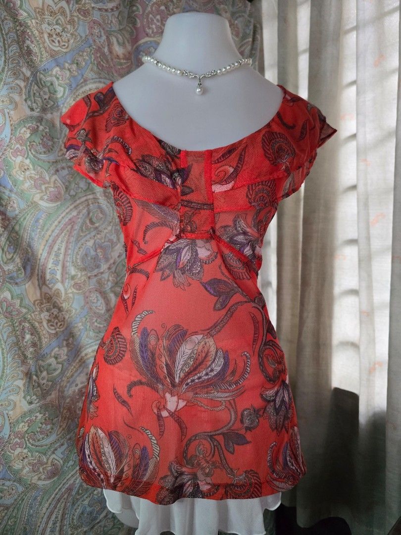 MEXX Sheer Floral Print Top (Category: Blouses) located in Dagupan City. Submitted by chislocker14 (Listing ID 1458568109, Image 1). Description: - Sheer red top with a bold floral print - Short sleeves - Estimated size: S to M - Lightweight and flowy fabric - Versatile for layering or wearing solo - Nice, eye-catching design.