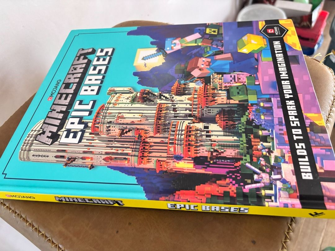 Minecraft Epic Bases Book by Mojang (Category: Storybooks) located in Makati City. Submitted by jed.castillo (Listing ID 1458549520, Image 3). Description: This book is the ultimate masterclass for any player looking to design and build mind-blowing structures—from hidden underwater bunkers and floating islands to massive, unraidable castles!It is packed with brilliant architectural inspiration, exploded diagrams, and insider design secrets. This