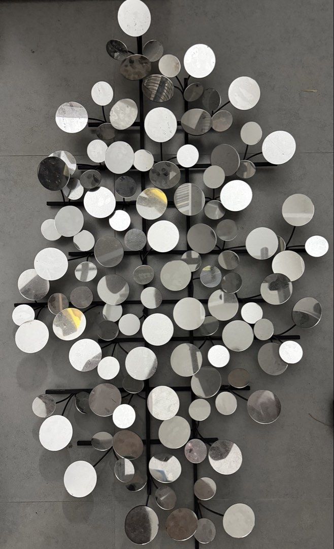 Modern Metal Circle Wall Art Decor (Category: Wall Decor) located in Taguig. Submitted by nicnixx (Listing ID 1458558030, Image 1). Description: - Unique wall art with multiple reflective circles - Modern design with metal branches - Adds an abstract touch to any room - Ideal for living rooms, hallways, or bedrooms - Easy to hang - for decluttering. Negotiable.