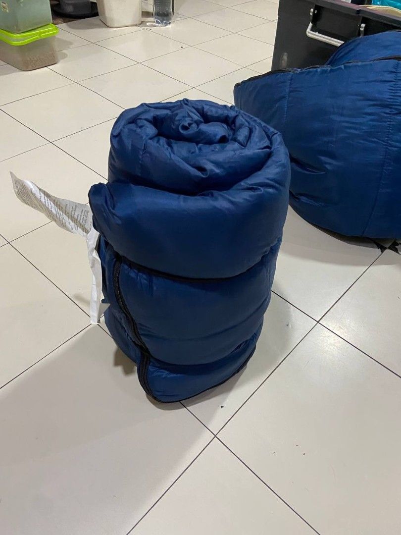 Mountain Trails Sleeping Bag Set of 2 (Category: Hiking & Camping) located in Manila. Submitted by chichaico (Listing ID 1458610061, Image 2). Description: - Two blue sleeping bags from Mountain Trails. - Unrolled one to showcase full size and vibrant blue color. - Ideal for camping adventures or fun sleepovers. - Designed for easy rolling and compact storage. - Includes straps to keep the sleeping bags neatly secured when rolled - Just needs som