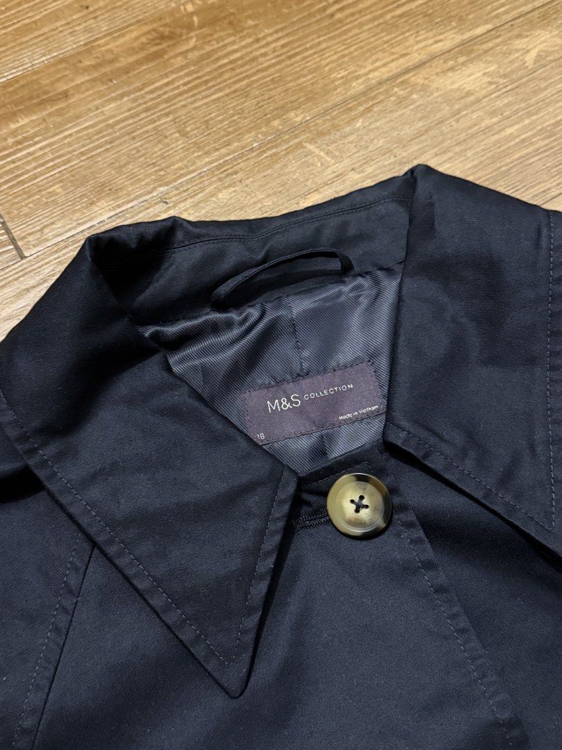 M&S Collection Navy Trench Coat Size 18 (Category: Coats, Jackets and Outerwear) located in Marikina City. Submitted by miene (Listing ID 1458533999, Image 1). Description: - M&S Collection Navy Trench Coat - Size 18 - Classic button-up style with collar - Front pockets - Perfect for layering - Measures 37 inches long - Measures 26 inches across the chest - Made in Vietnam.