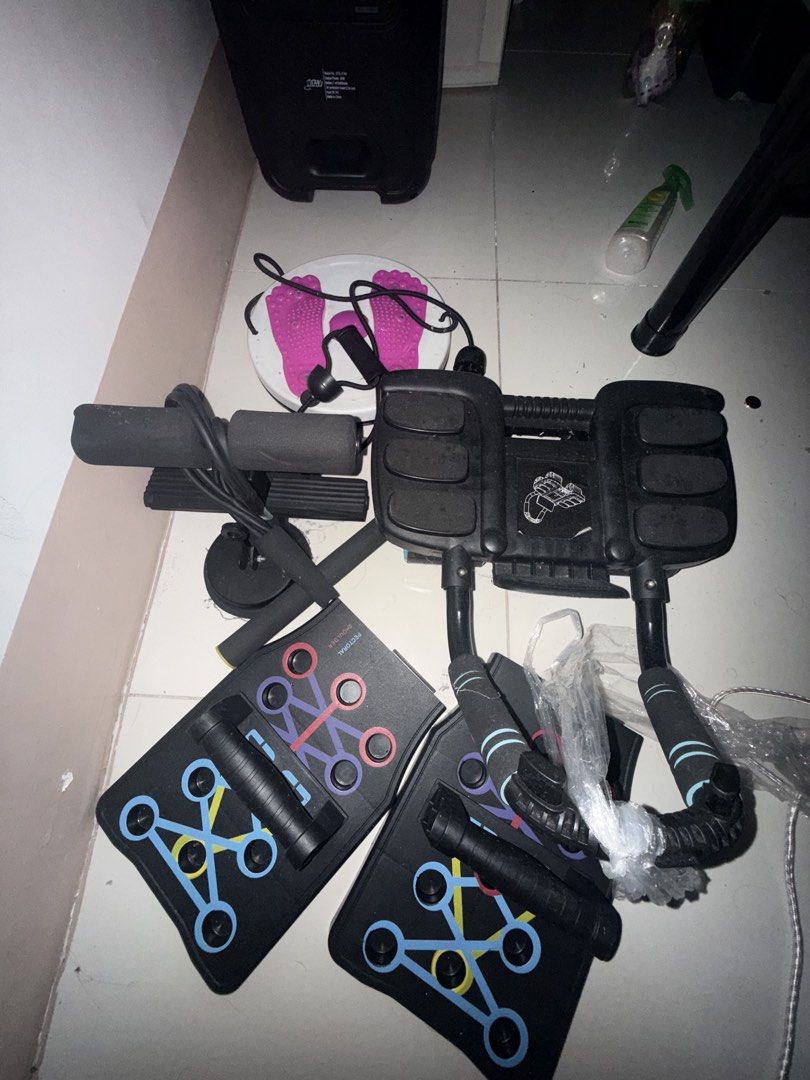 Multi-functional Home Gym Equipment Set with Push-up Board (Category: Weights & Dumbbells) located in Quezon City. Submitted by gavinarevalo (Listing ID 1458529948, Image 2). Description: - Complete home gym set for a full body workout. - Includes a push-up board with multiple grip positions. - Comes with a sit-up assistant. - Features a twisting waist disc for core training. - Ideal for strength training and cardio at home. - All pieces are blac