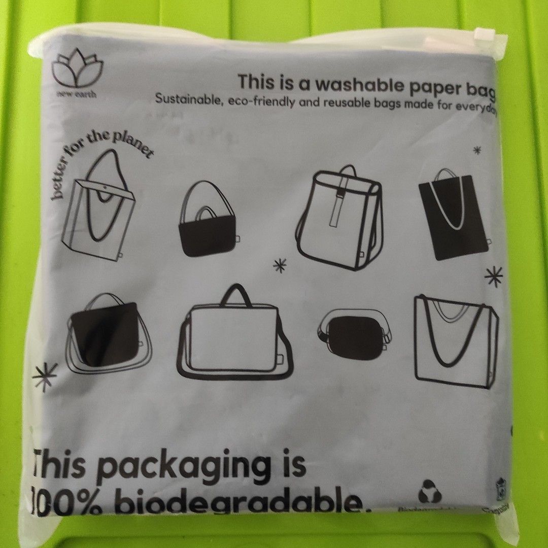 New Earth Washable Paper Bag - Black (Category: Tote Bags) located in Quezon City. Submitted by mjp918557503 (Listing ID 1458563591, Image 3). Description: New Earth Ecocraft Washable Sling Bag - Black PRODUCT SPECIFICS: Length: 10 inches Width: 4 inches Height: 10 inches Sling: 24 inches maximum length Short Handle: 5 inches Comes with two handles WHY WILL YOU LOVE NEW EARTH SLING WASHABLE PAPER BAG? - Sustainably-made with natural cellulose fib