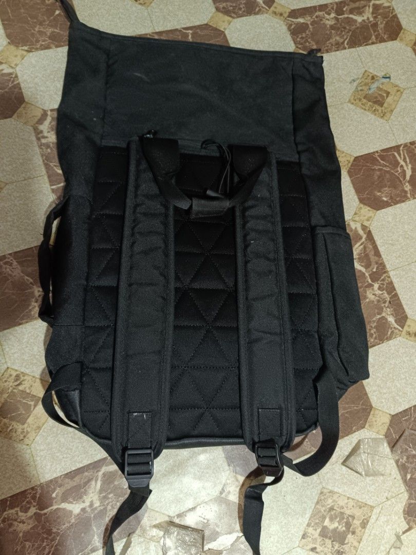 Nike Black Backpack (Category: Backpacks) located in Manila. Submitted by caaths_collection (Listing ID 1458523709, Image 3). Description: - Black Nike backpack - Main compartment with drawstring and flap closure - Front zip pocket for easy access - Padded straps for comfort - Side pockets - Ideal for daily use - what you see its what you get.
