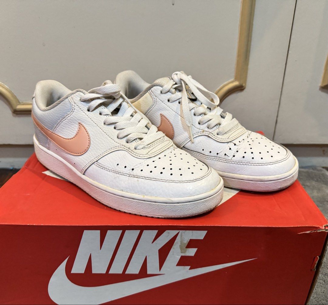 Nike Court Vision Low Sneakers (Category: Sneakers) located in Manila. Submitted by hakunashop (Listing ID 1458576169, Image 2). Description: - Classic white Nike low-top sneakers - Features a stylish peach swoosh - Minor scuffs on soles and toe box from normal wear - Plenty of life left for continued use - Comes with the original Nike box - Size US 8.5 or 25.5cm.