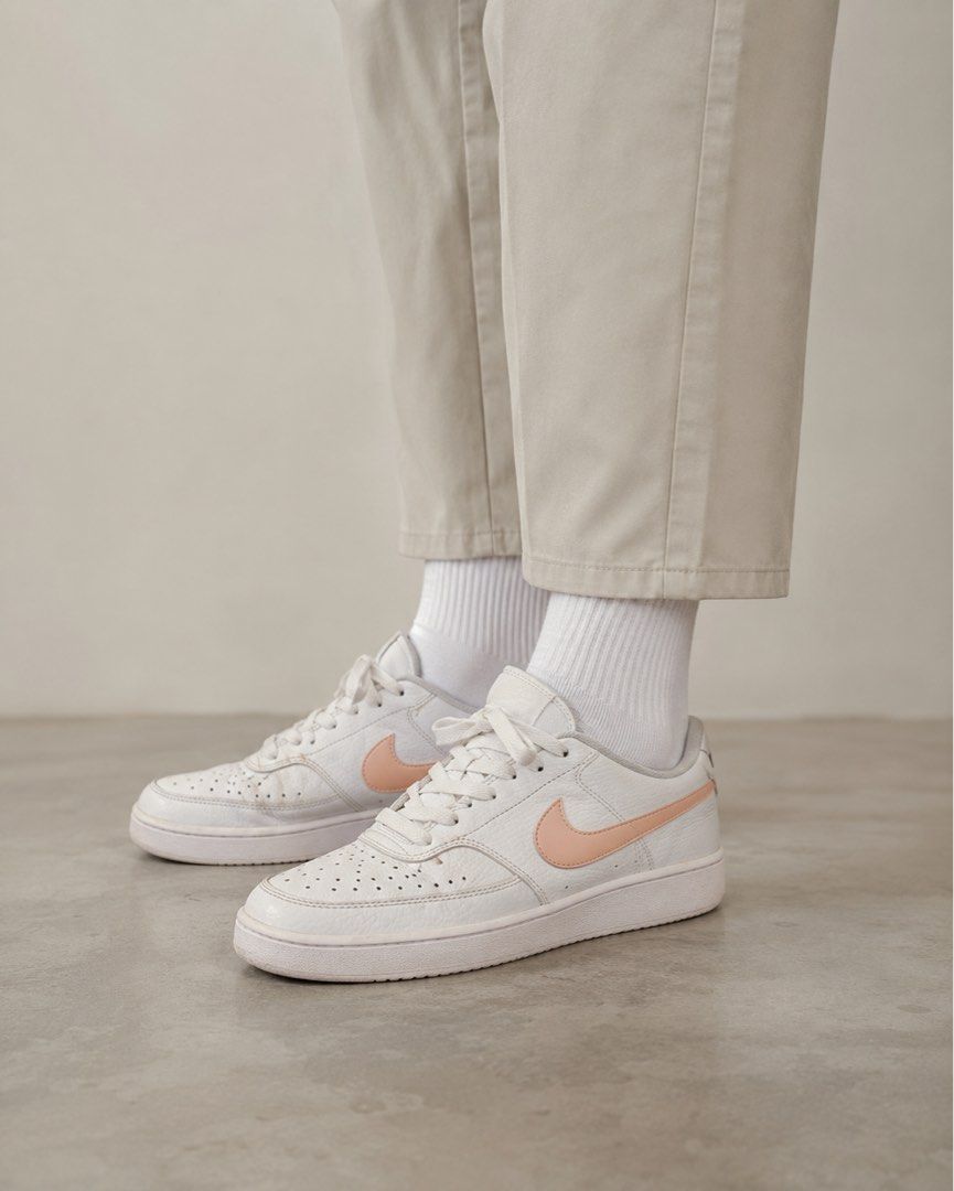 Nike Court Vision Low Sneakers (Category: Sneakers) located in Manila. Submitted by hakunashop (Listing ID 1458576169, Image 1). Description: - Classic white Nike low-top sneakers - Features a stylish peach swoosh - Minor scuffs on soles and toe box from normal wear - Plenty of life left for continued use - Comes with the original Nike box - Size US 8.5 or 25.5cm.