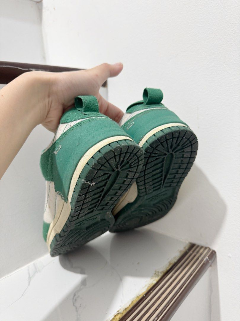 Nike Dunk Low Green Cream (Category: Sneakers) located in Iloilo. Submitted by itsdanicanicole (Listing ID 1458608702, Image 3). Description: - Nike Dunk Low - Color: Green and Cream - Size: US 8 - Condition: Shows some signs of wear on soles and suede - Note: Laces are missing - Perfect for casual wear and everyday style.