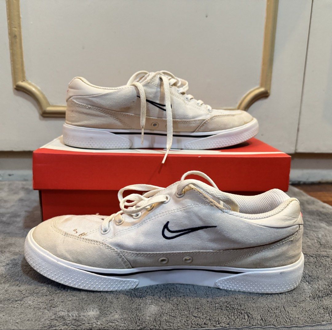 Nike Retro GTS 97 Women's (Category: Sneakers) located in Manila. Submitted by hakunashop (Listing ID 1458558763, Image 3). Description: - Classic white Nike canvas sneakers - Features iconic navy Nike swoosh - Stylish suede accents on toe box and sides - Secure lace-up closure - Comfortable and versatile for everyday casual outfits - Includes original Nike box - Bought from Zalora (Original) - Needs cleaning - Size 8.5 or 25.5cm.