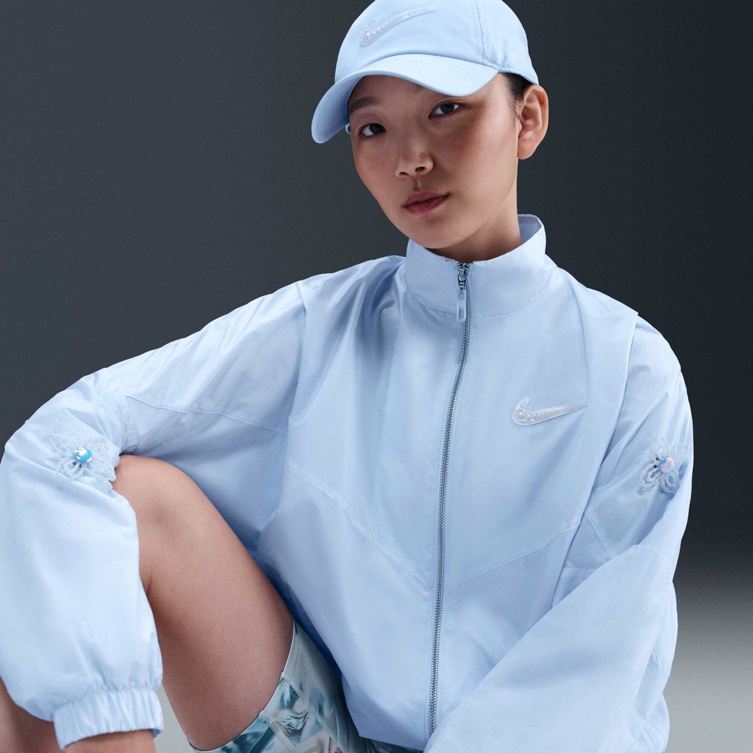 Nike Track Jacket (Category: Coats, Jackets and Outerwear) located in Taguig. Submitted by xandrascloset (Listing ID 1458558115, Image 1). Description: - Light blue Nike track jacket - Zip-up front - Stand-up collar - Cute butterfly details on sleeves removable - Lightweight and breezy feel - Ideal for casual wear or light workouts.