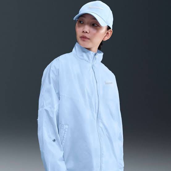 Nike Track Jacket (Category: Coats, Jackets and Outerwear) located in Taguig. Submitted by xandrascloset (Listing ID 1458558115, Image 3). Description: - Light blue Nike track jacket - Zip-up front - Stand-up collar - Cute butterfly details on sleeves removable - Lightweight and breezy feel - Ideal for casual wear or light workouts.