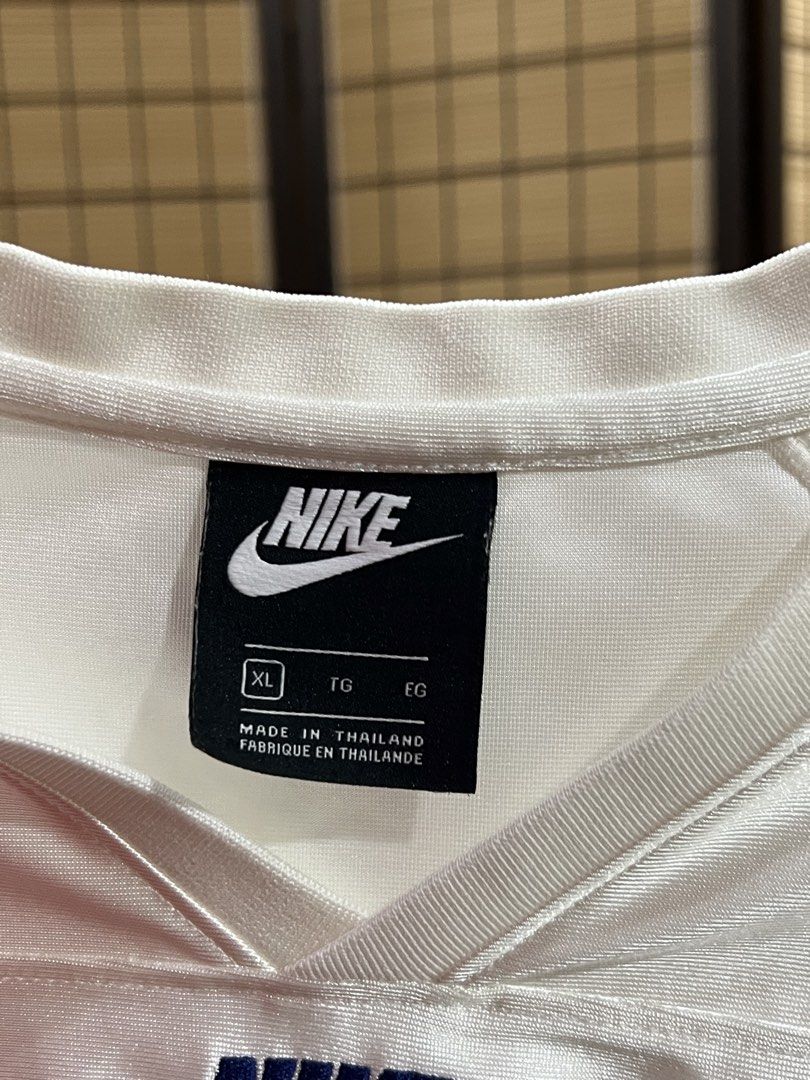 Nike White Jersey XL TG EG (Category: Activewear) located in Subic. Submitted by xzikyra (Listing ID 1458680872, Image 2). Description: - White Nike Jersey - Size: XL (teen size) - Unique all-over graphic print on lower half - Nike logo on chest - Navy blue accents on collar and shoulders - Made in Thailand.