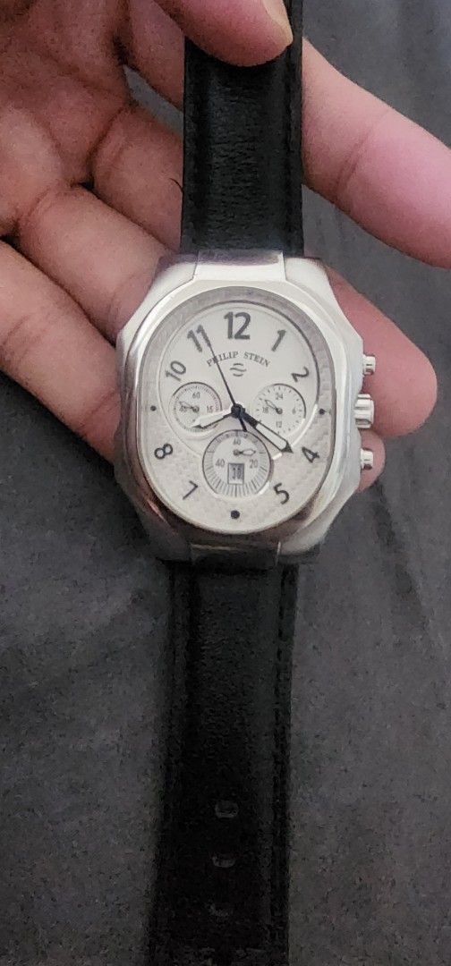 Philip Stein Chronograph Watch Black Leather Strap (Category: Luxury Watches) located in Pasig City. Submitted by anovharz (Listing ID 1458626038, Image 1). Description: - Authentic Philip Stein Chronograph Watch - Elegant Silver Tone Case - Crisp White Dial with Stopwatch Subdials - Comfortable Black Leather Strap with Buckle Closure - Water Resistant up to 5 ATM - Durable All Stainless Steel Construction - Serial Number: 23TF002713 negotiable w