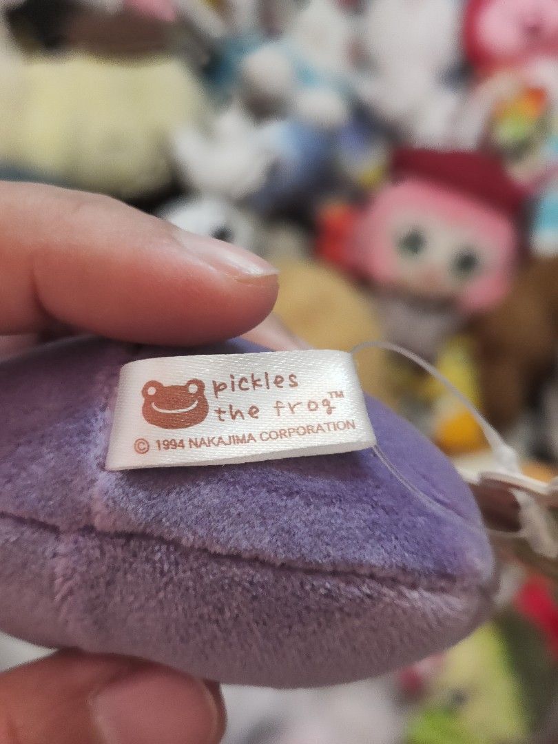 Pickles the Frog Purple Head Plush Charm (Category: Plushies & Soft Toys) located in Antipolo. Submitted by bhabiegraciefashionlab (Listing ID 1458616624, Image 3). Description: Pickles the Frog Plush Charm brand new with Papertag sk japan/nakajima color: purple #picklesthefrog #plushcharm #keychain #bagcharm.