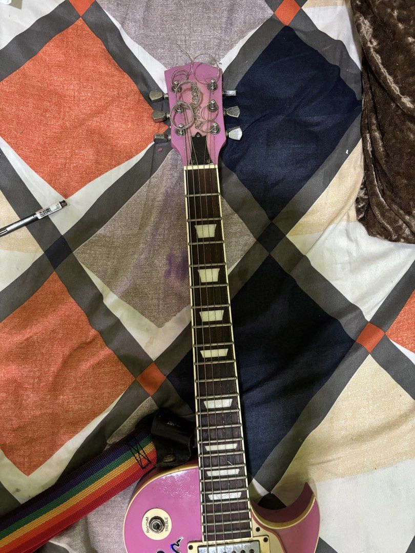 Pink Electric Guitar with Rainbow Strap (rush) (Category: Musical Instruments) located in General Mariano Alvarez. Submitted by havenzxc (Listing ID 1458538740, Image 3). Description: PINK ELECTRIC GUITAR (rush) W STRAP CAN DO MEETUPS AROUND DASMA CAN DO SHIPPING ( BUYER WILL BOOK OWN RIDER) RFS- Di na nagagamit nakatambak na lang Honest issue - Minor scratches -old strings (need new) -need cleaning Other than that po plug and play na.