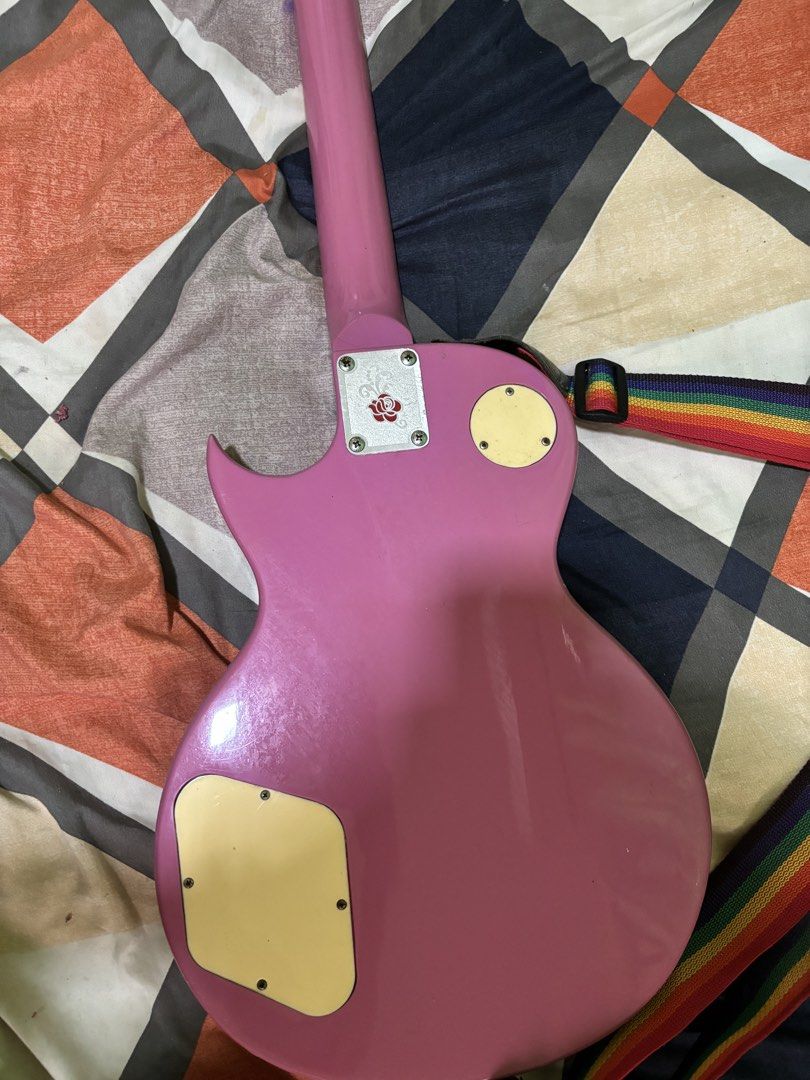 Pink Electric Guitar with Rainbow Strap (rush) (Category: Musical Instruments) located in General Mariano Alvarez. Submitted by havenzxc (Listing ID 1458538740, Image 2). Description: PINK ELECTRIC GUITAR (rush) W STRAP CAN DO MEETUPS AROUND DASMA CAN DO SHIPPING ( BUYER WILL BOOK OWN RIDER) RFS- Di na nagagamit nakatambak na lang Honest issue - Minor scratches -old strings (need new) -need cleaning Other than that po plug and play na.