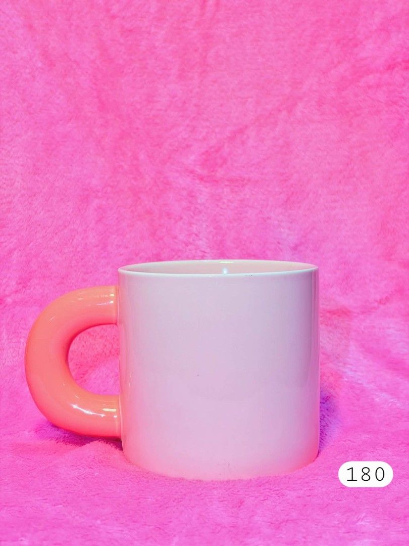 Pink Mug with Unique Coral Handle (Category: Coffee & Tea Tableware) located in Subic. Submitted by swift.thriftz (Listing ID 1458595548, Image 1). Description: - Adorable pink mug with a unique, rounded coral-colored handle. - Perfect for your morning coffee or tea. - Adds a fun pop of color to your kitchen or desk. - Dishwasher safe for easy cleaning. - Generous capacity for your favorite beverages..