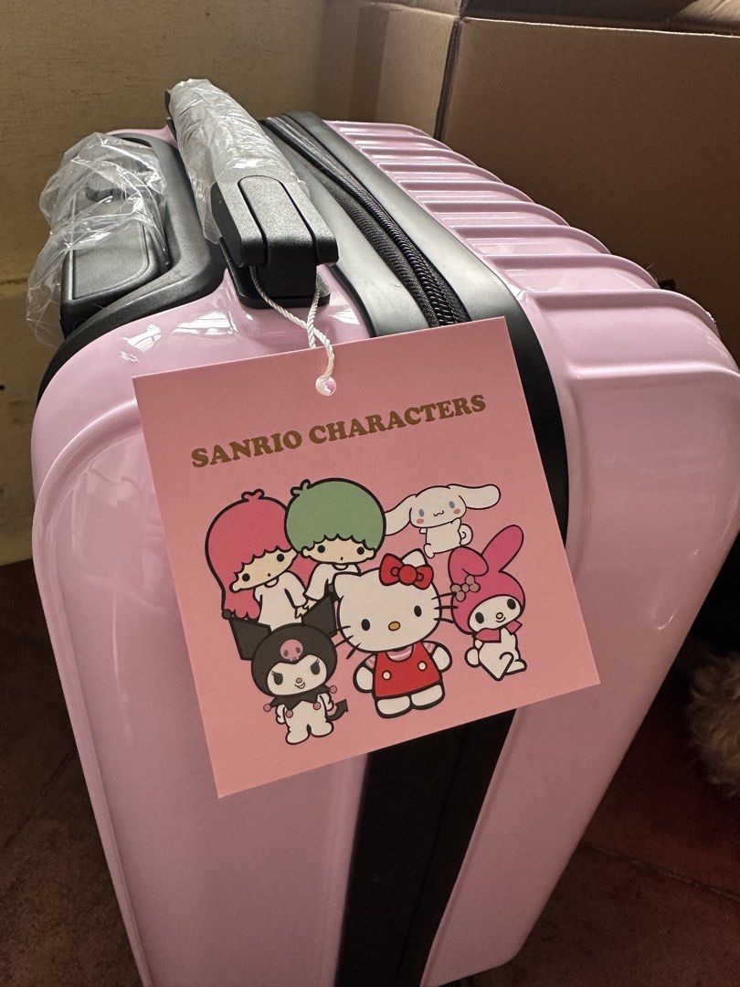 Pink Sanrio Hello Kitty Hard Case Luggage (Category: Luggage) located in Quezon City. Submitted by sabab.png (Listing ID 1458559064, Image 2). Description: -Hello kitty embossed hard case hand carry luggage - built-in combination lock for security - 360 wheels - approx (16in x 14in x 8in) (lwh) DM for more details.