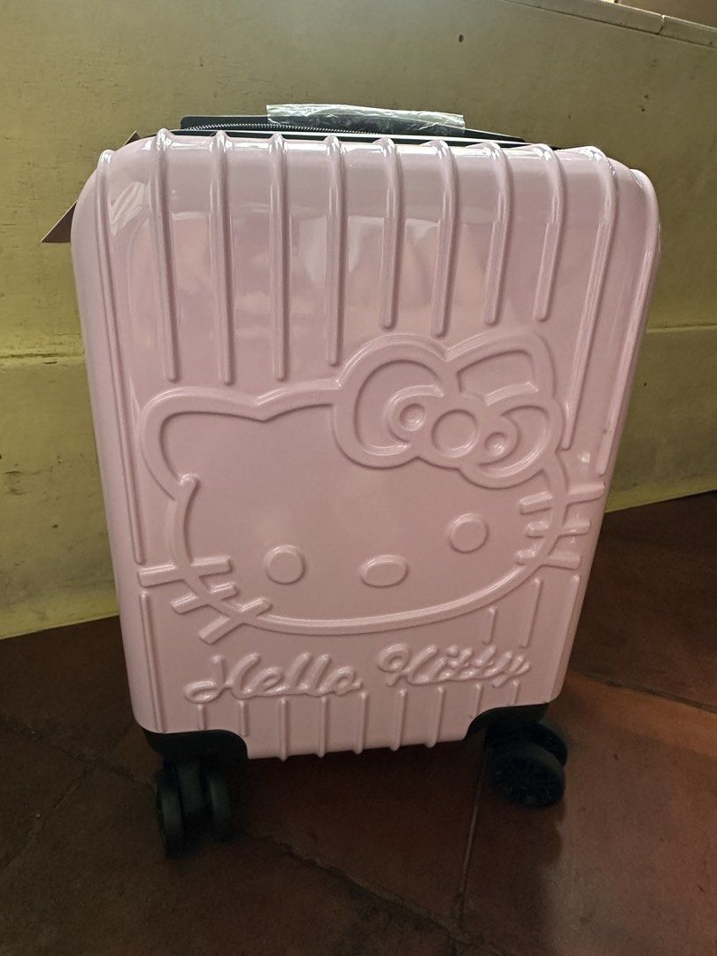 Pink Sanrio Hello Kitty Hard Case Luggage (Category: Luggage) located in Quezon City. Submitted by sabab.png (Listing ID 1458559064, Image 3). Description: -Hello kitty embossed hard case hand carry luggage - built-in combination lock for security - 360 wheels - approx (16in x 14in x 8in) (lwh) DM for more details.